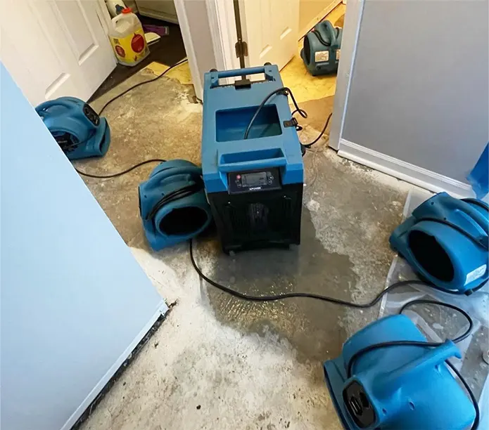 Air movers drying a floor after a water loss in Pomona, CA